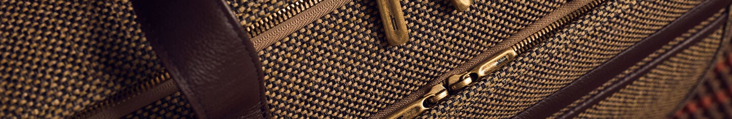 banner image is an up close shot of the Tweed Travel Duffel.