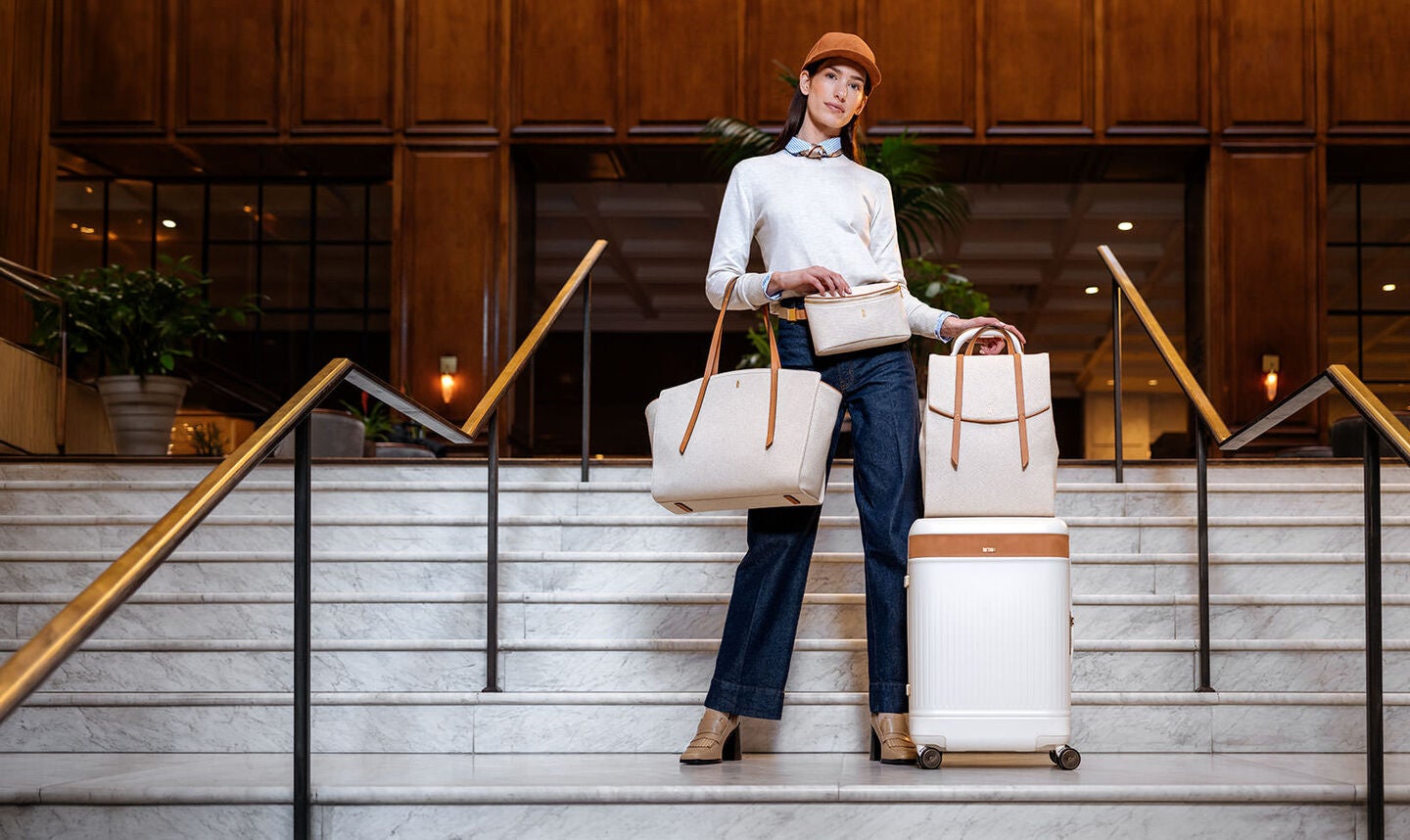 Image shows female model with all the Women's Reserve travel pieces. Click here to explore all of Reserve. 