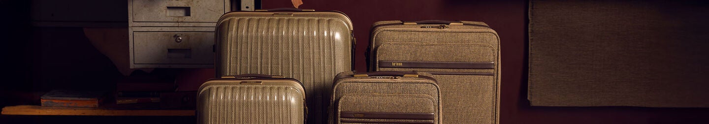 Banner showing both Tweed softside and Tweed harside global carry-on and extended long journey spinners.