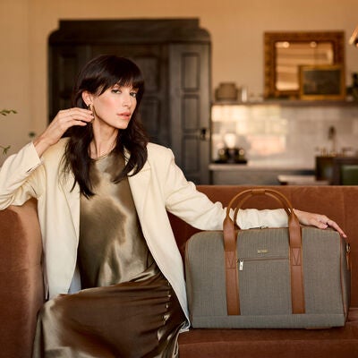 Hartmann Herringbone Deluxe Weekend Duffel, Terracotta Herringbone, Model with duffel next to them